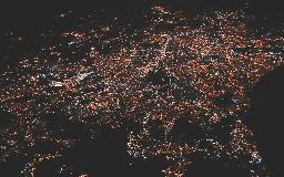 lighted city at night aerial photo