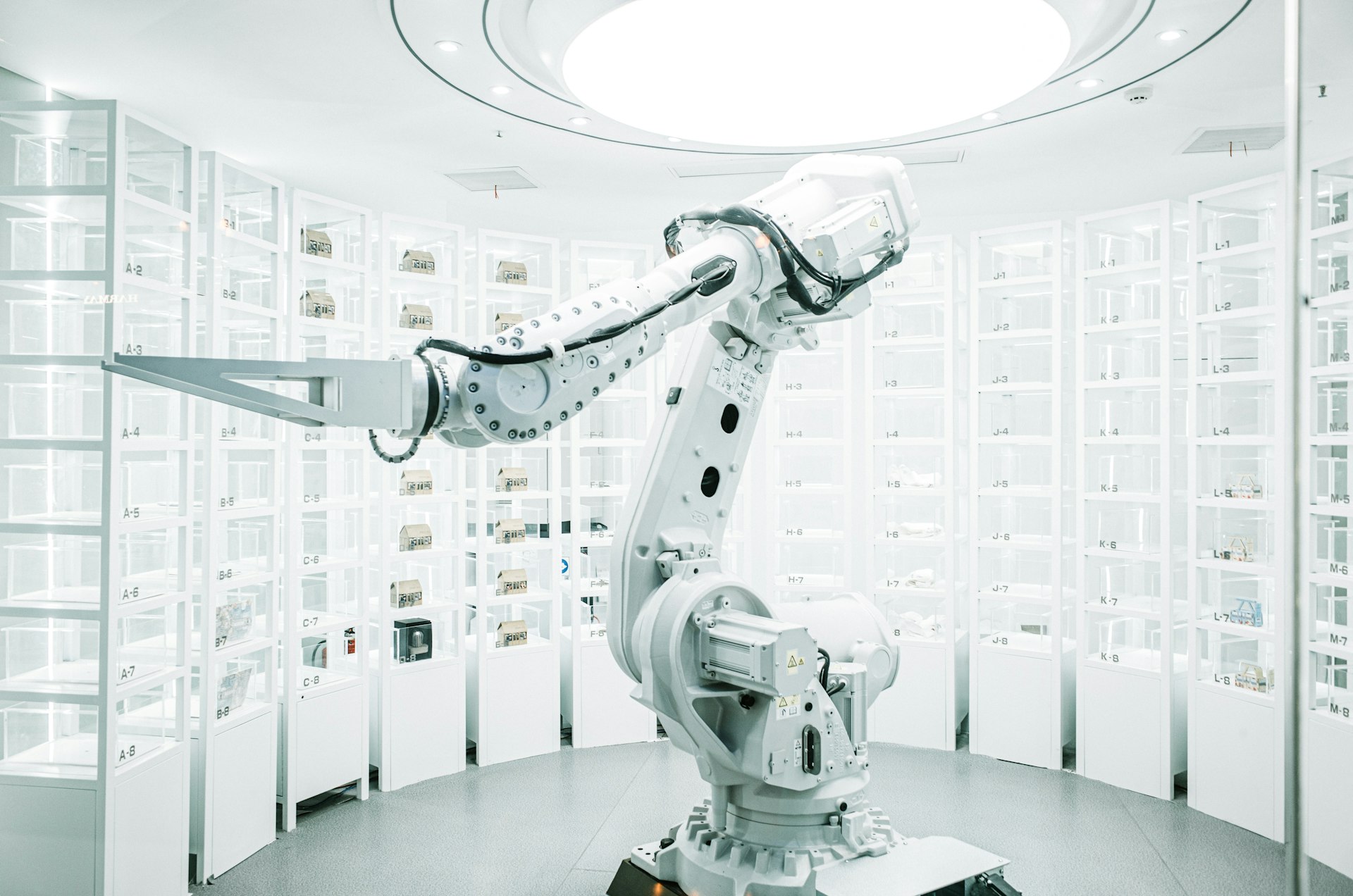 white robotic arm in display showroom